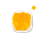 Close-up of mango star jelly featuring adorable yellow star-shaped pieces with a crunchy and chewy texture to add fun visual appeal to beverages.
