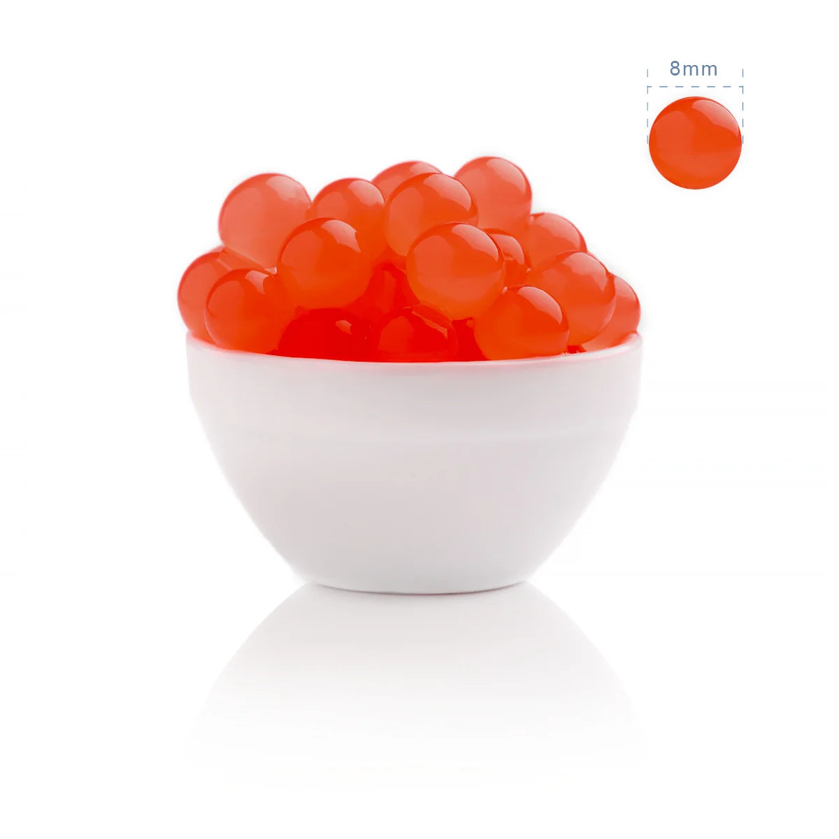 Close-up of orange fusion popping boba in a bowl, showing the standard 8mm size for bubble tea.