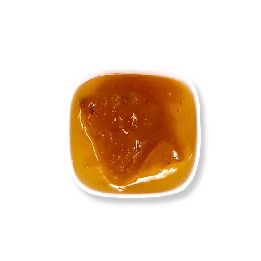 Close-up of pineapple jam texture, featuring a golden bright and rich fruit preserve consistency.