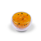 Close-up of tropical fruit jam texture, featuring rich fruit puree with real fruit pieces and seeds for a natural preserve consistency.