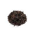 Heavily roasted dark Tie Guan Yin oolong tea leaves for espresso extraction.